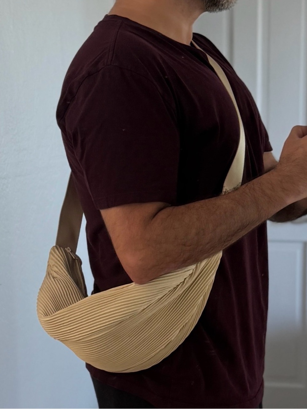 COS pleated crossbody bag in cream/tan.